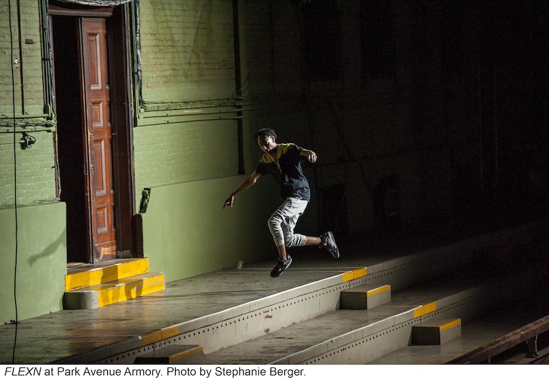 A FLEXN dancer leaps from the stairs on the expansive Park Avenue Armory stage